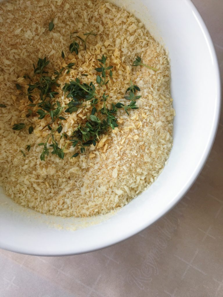 panko breadcrumbs with thyme and onion flakes in a bowl