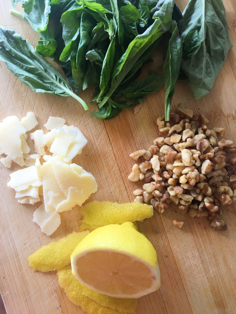 Walnut Gremolata ingredients ready to be chopped on a cutting board