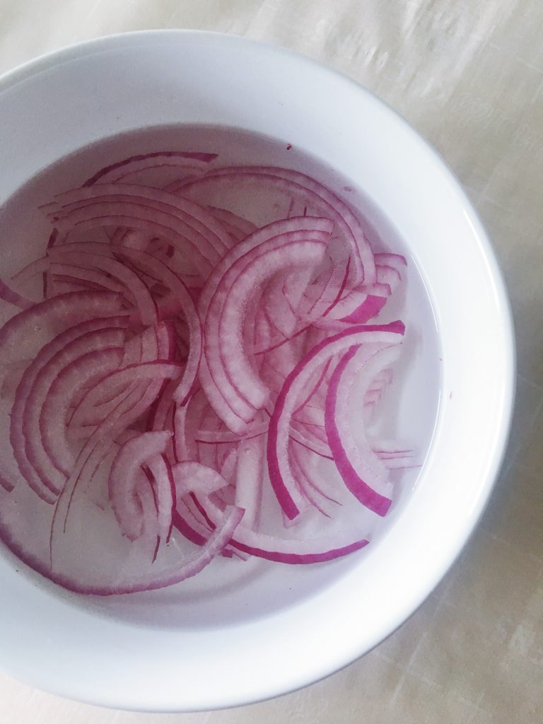 soaked red onions to garnish baked sweet potato
